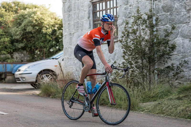 Felix Young riding on John O'Groats to Land's End in 2014