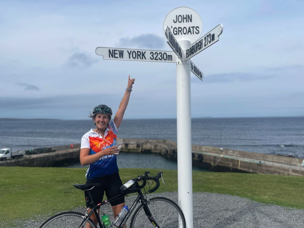 All smiles in John O'Groats after completing Land's End to John O'Groats, one of our 2024 Charity Bike Rides for MS